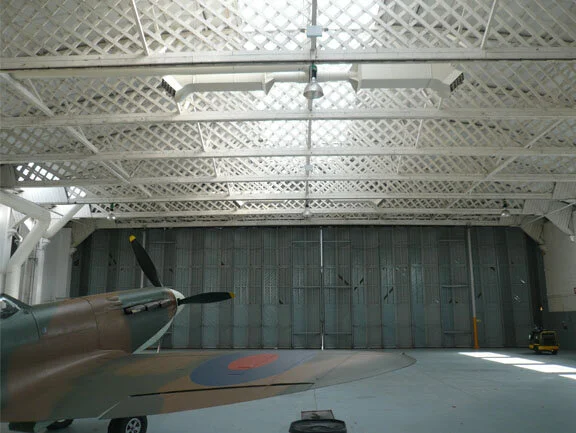 Through the modern eye of a digital lens, we can see just how it would have appeared to maintainers as they readied a  Spitfire inside the doors on the hangar line.