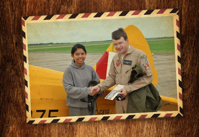 After her flight in the Stearman with me, 14-year-old Air Cadet Inalie Portades, of Saskatoon, SK had this to say about her flight: “Flying in the Stearman, I felt like I was the happiest person in the world at that time. The best part was when Jeff, my pilot, let me steer and step on the pedals and make an awesome turn to the left. I felt like I was really lucky to be chosen. If I get the chance, I will apply for both a glider and a power pilot license. Then, I will go step by step to become a pilot. Of course I would thank the sponsors and donors a million times for giving me this experience to fly with this one of a kind vintage aircraft. Also, I would share this experience with other people and tell to them that without the donors and sponsors, I wouldn’t have a chance to fly a Stearman.” Photo by Tim Wun