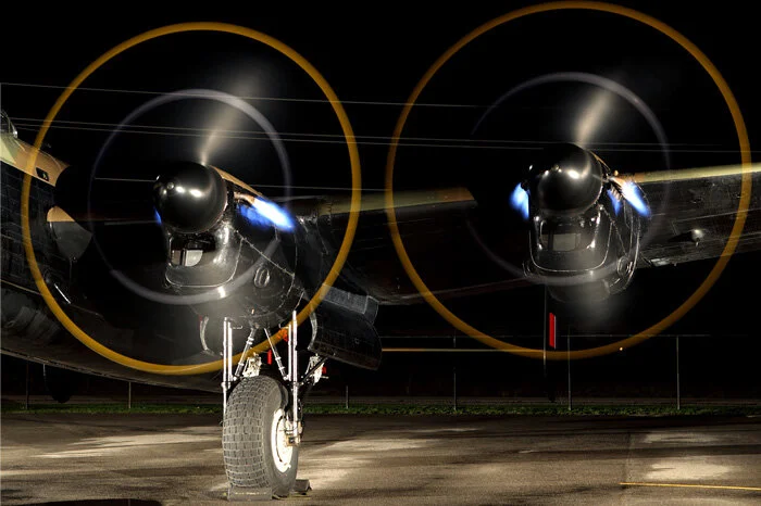 Close up of the two port engines belching blue flames. Photo: Parr Yonemoto