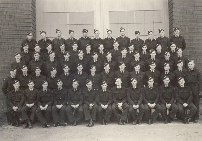 Thousands of students went through No. 36 SFTS at Penhold. Each course sat for their group photograph. Here we see the students (with white cap flashes) of Course No. 105 sitting for the station photographer in June 1944. Photo: F/O Ray Morgan, via Nektonic at Flickr