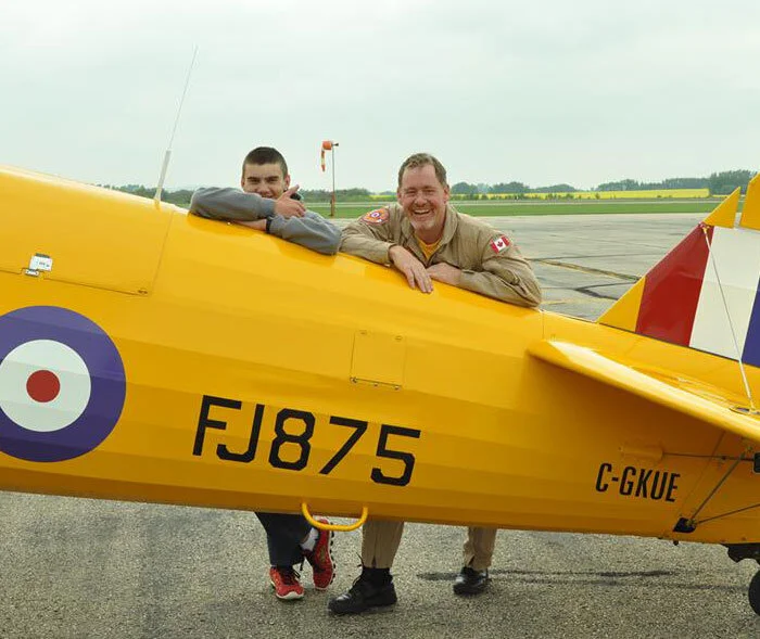 Pilot Krusti Whelan and his “student” Gregory Esman pose with the Harry Hannah Stearman after their flight. Esman is currently a Flight Sergeant at 872 “Kiwanis Kanata” Air Cadet Squadron, and he had this to say about his experience: “My flight with Vintage Wings was absolutely fantastic. One of my favourite parts was actually flying the Stearman. That was an exciting, rare, and an extremely fun experience. The fact that I was even given the opportunity to fly in a Vintage Wings aircraft is a gift in itself, but actually being picked as one of the lucky cadets to fly in one is amazing. If I were to get the chance to meet one of the generous donors, I would definitely give them all my gratitude for their ongoing efforts to keeping this amazing program going.” Photo: Yellow Wings Stearman Team