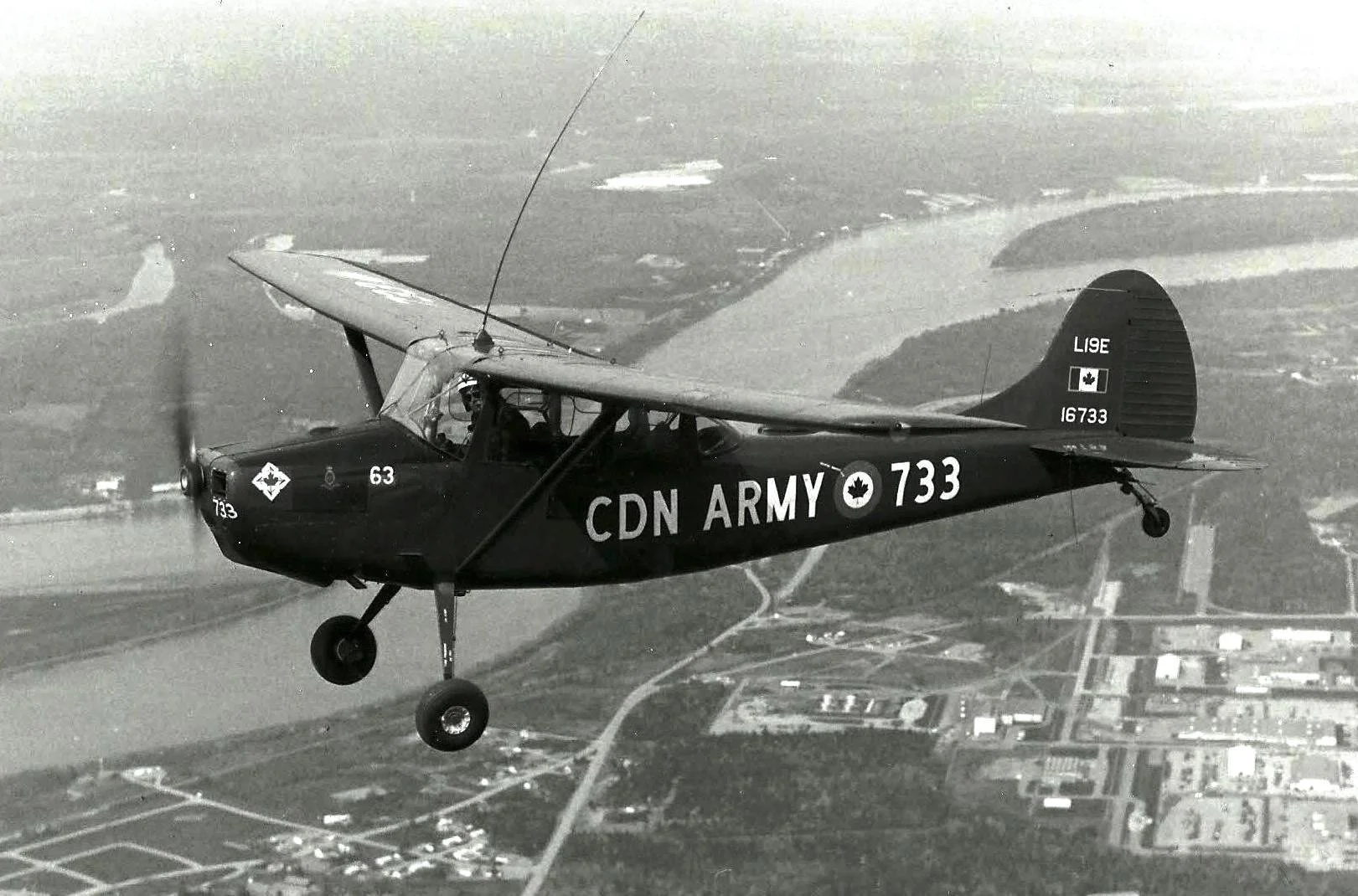 66af4e3ecf72050c196cecb1_60f424b7aefa52121d30d2d8_Cessna-L-19E--Serial-No--16733---Canadian-Army-in-flight.jpeg