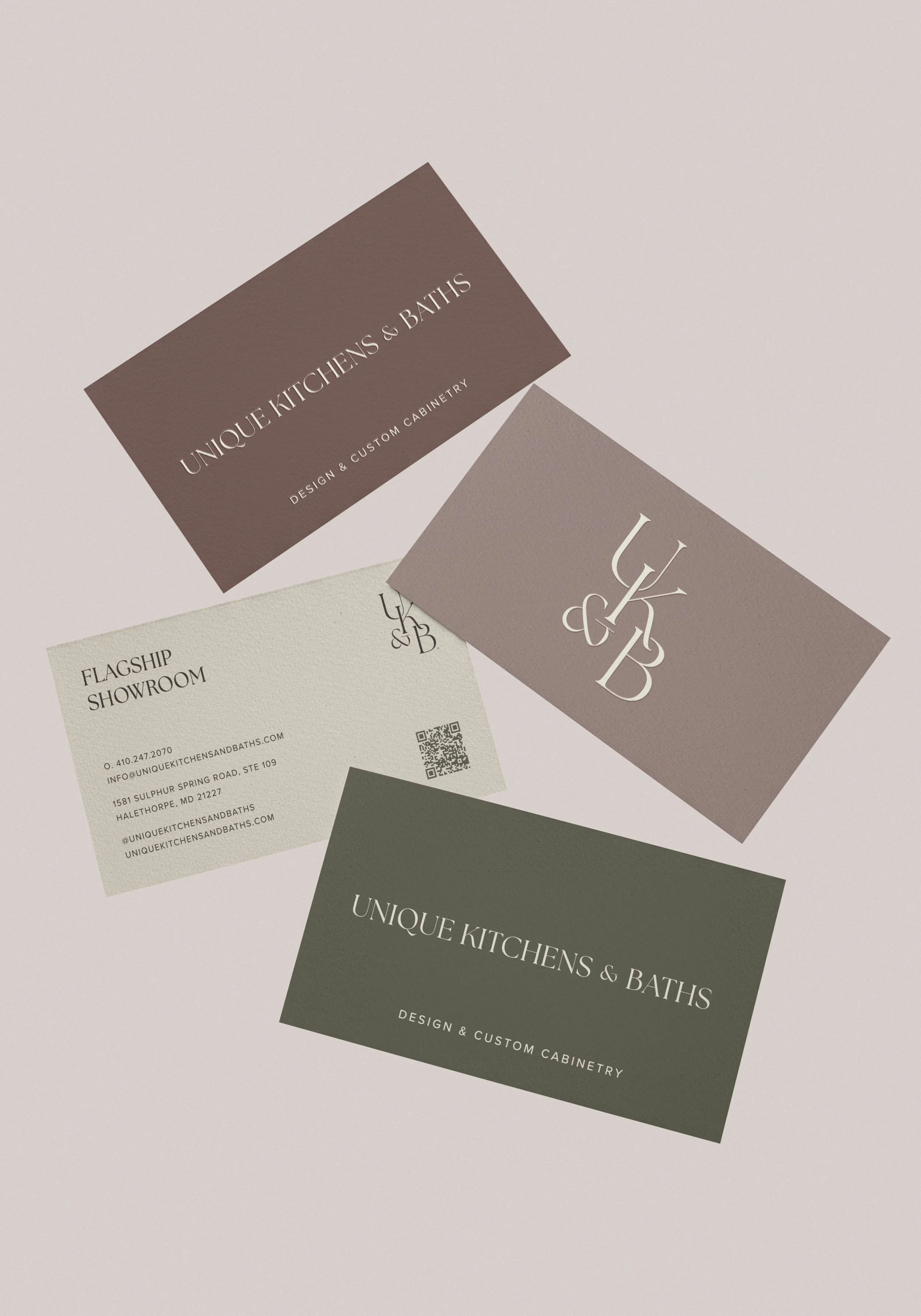 Business cards and a logo card for Unique Kitchens & Baths, featuring branding with neutral colors and clean typography.