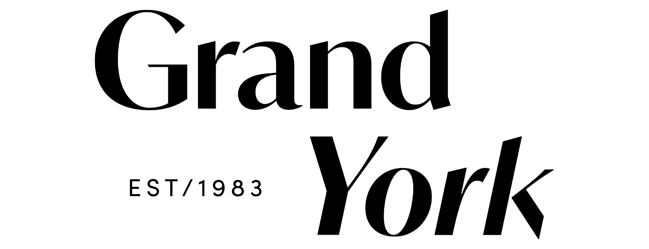 A black and white photograph of a large hand holding a paintbrush, painting on a large canvas.