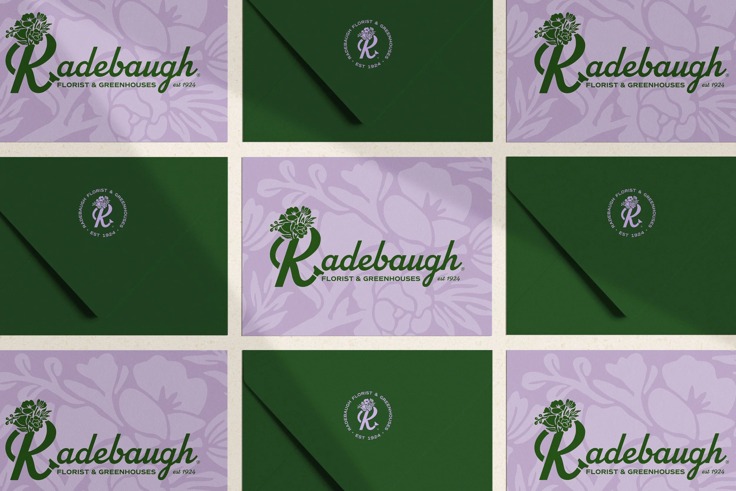 A collection of Radebaugh Florist & Greenhouses branded packaging and envelopes with purple floral and green leaf designs.