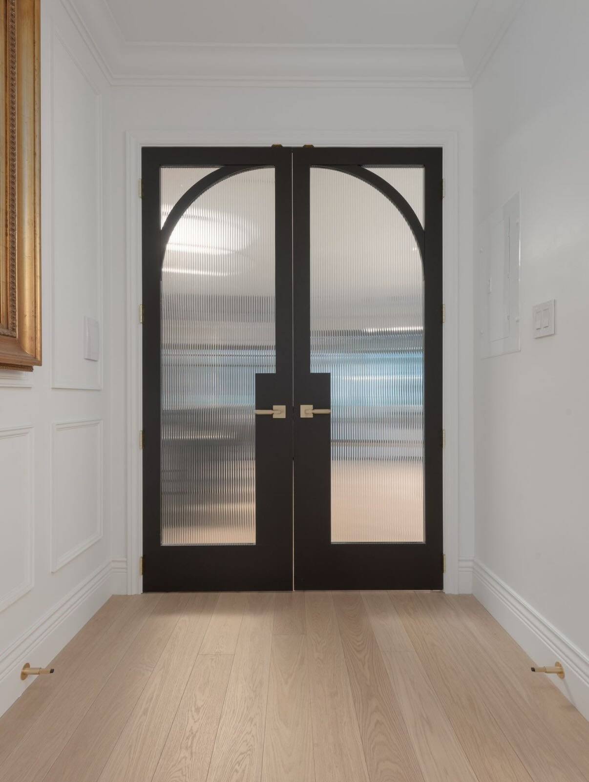 A moment of arrival ✨

These beautifully crafted doors do more than divide spaces &mdash; they set the tone. Separating the kitchen, bar, and family room from the formal living and dining, they create a sense of intention, drama, and flow all at once