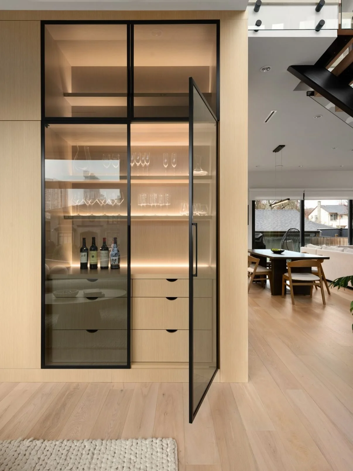 A bar designed not for crowds&mdash;but for connection.

Tucked seamlessly into the formal living room, this custom bar becomes a quiet backdrop for intimate conversations, slow pours, and evenings that linger a little longer. Soft interior lighting,