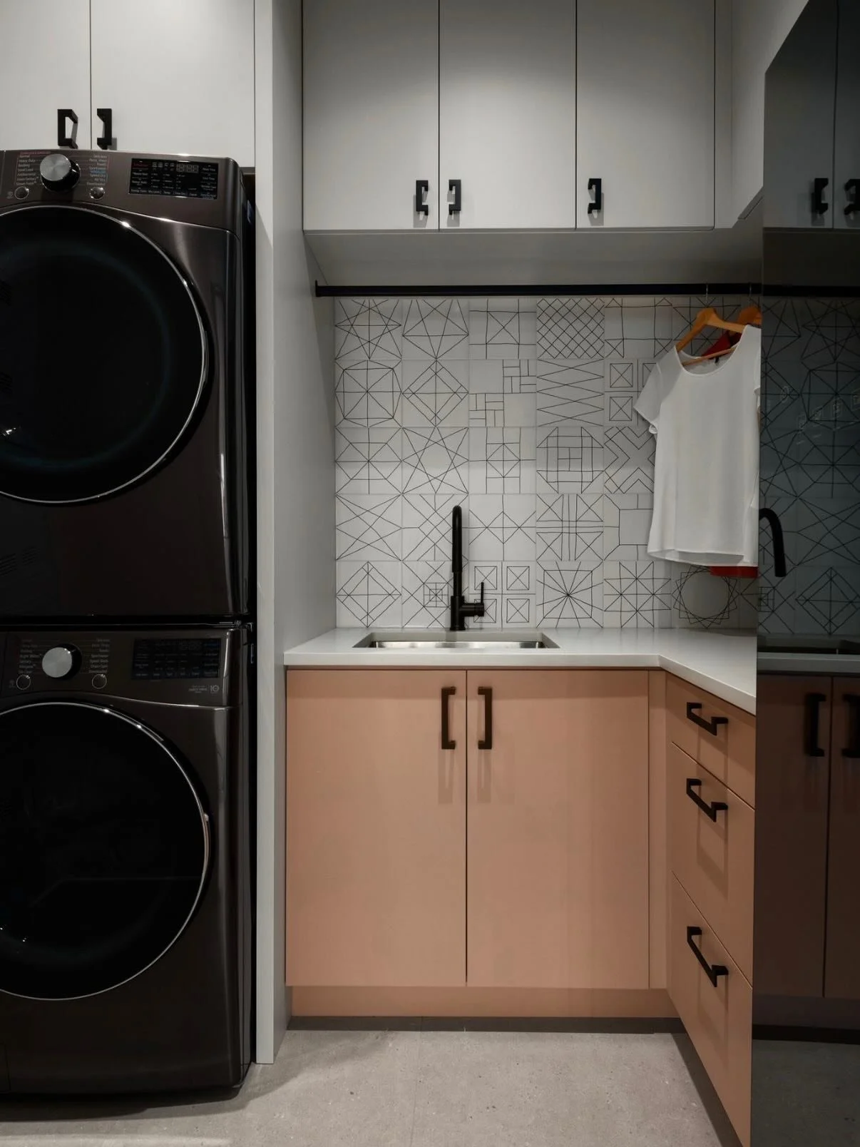 Laundry&hellip; but make it happy.
Soft blush cabinetry, graphic tile, and just enough contrast to keep things interesting&mdash;because even everyday spaces deserve a little personality.

Designed to feel fresh, functional, and a joy to use (yes, ev