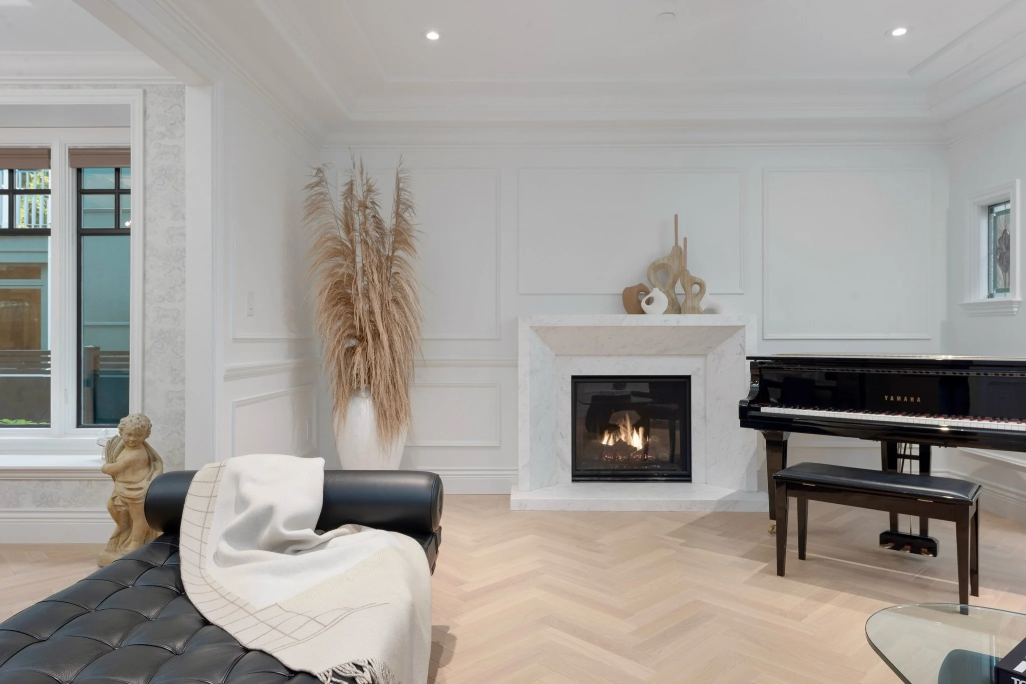 Golden hour, warm fires, and the soft hum of the piano. 🎹🎶

This is home. 🔥🤍

.

.

.

.

#interiordesign #luxuryliving #modernclassic #interiorstyling #homedesign