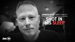 Close-up of a man in a police or detective uniform, with text overlay about an unsolved crime.