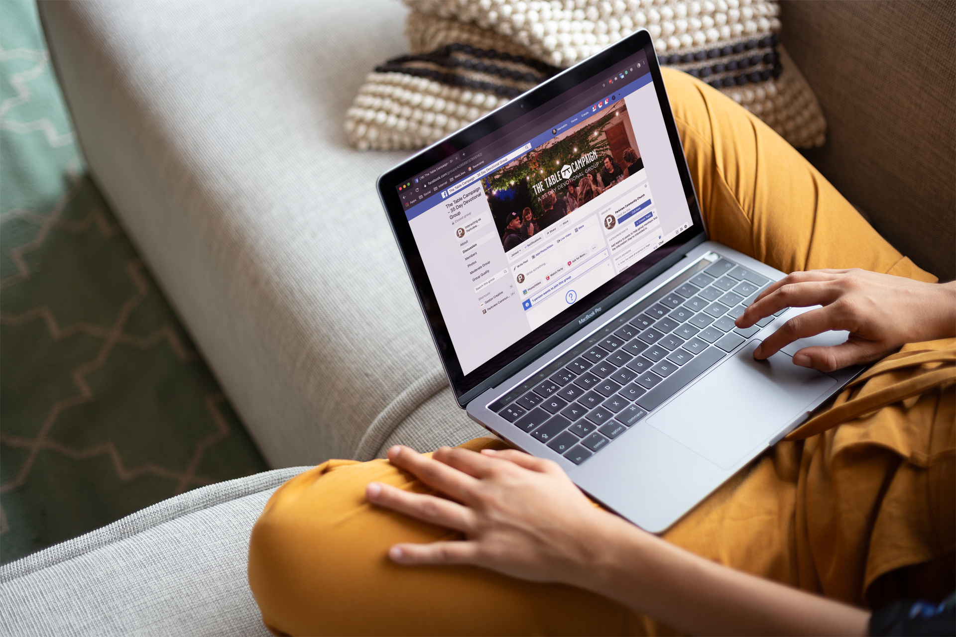 woman-working-with-a-macbook-mockup-sitting-on-a-sofa-a21180 (1).png