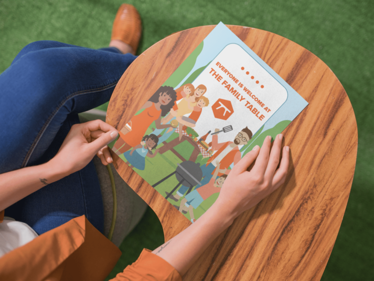 mockup-of-a-woman-about-to-open-a-booklet-while-sitting-down-in-a-wooden-desk-a14647-2-1024x768.png