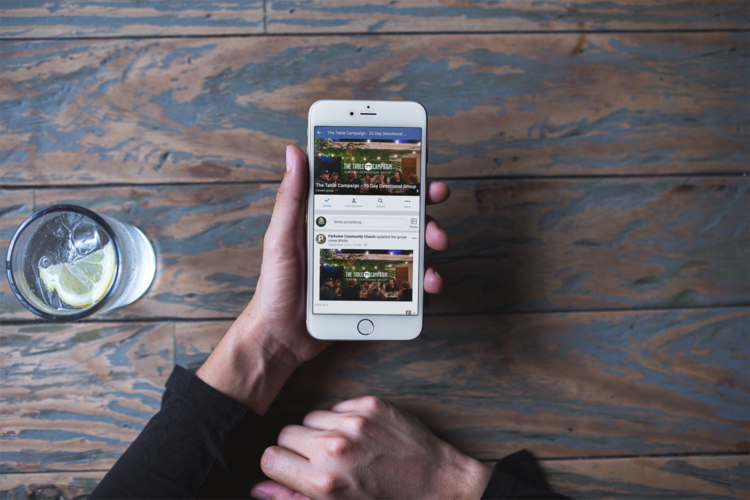 mockup-of-a-silver-iphone-8-plus-being-held-next-to-a-glass-of-lime-water-a21599.png