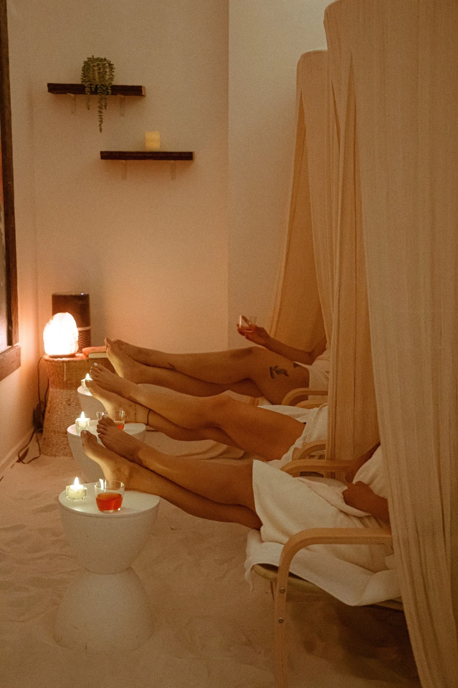 Clients relaxing in a calm recovery space at City Sweats as part of a wellness coaching experience focused on rest and nervous system support.