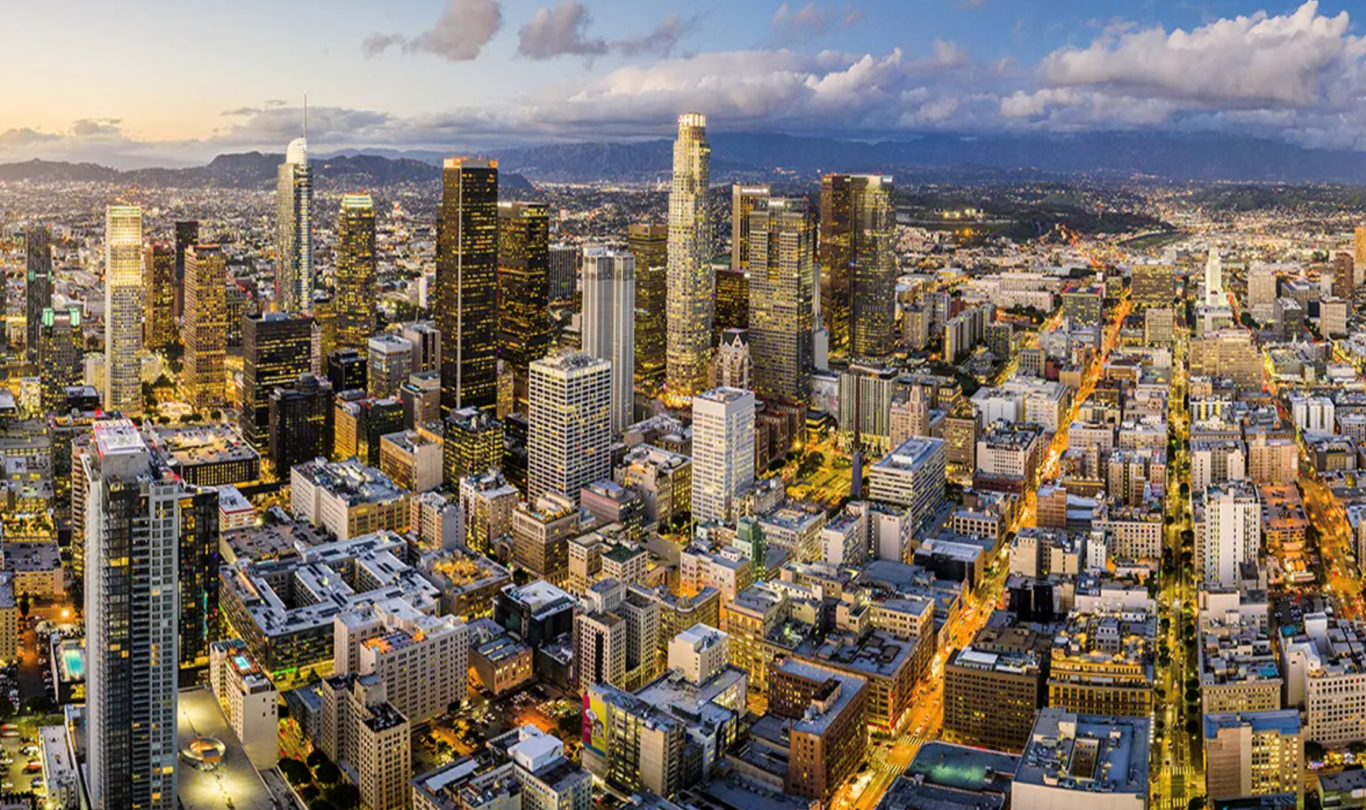 Los Angeles California skyline at sunset, representing a large and diverse market for wellness franchise opportunities.