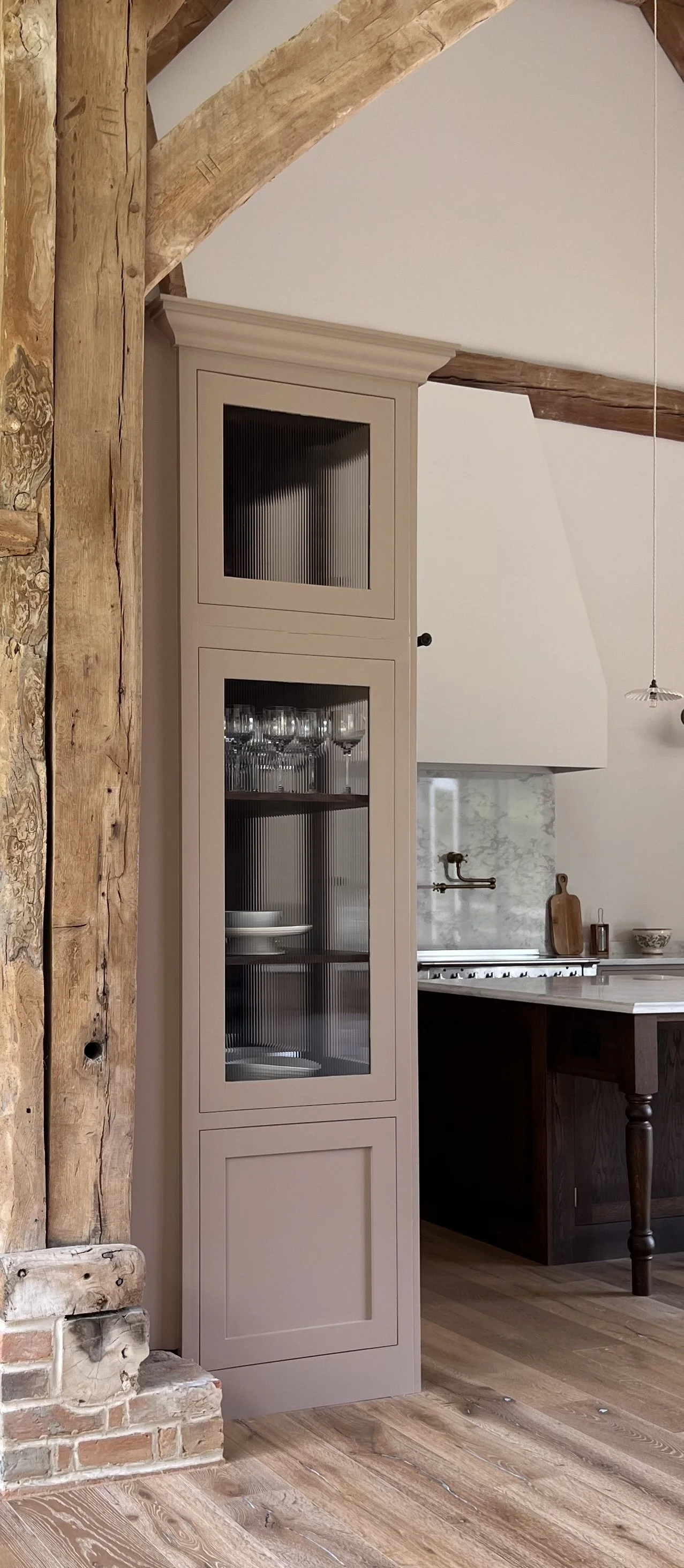 Bespoke kitchen with large island in a beautiful old Cotswold barn