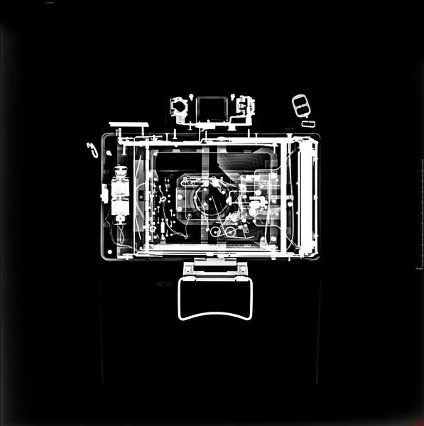 Black and white x ray of polaroid camera, copyright Rebecca Hackemann