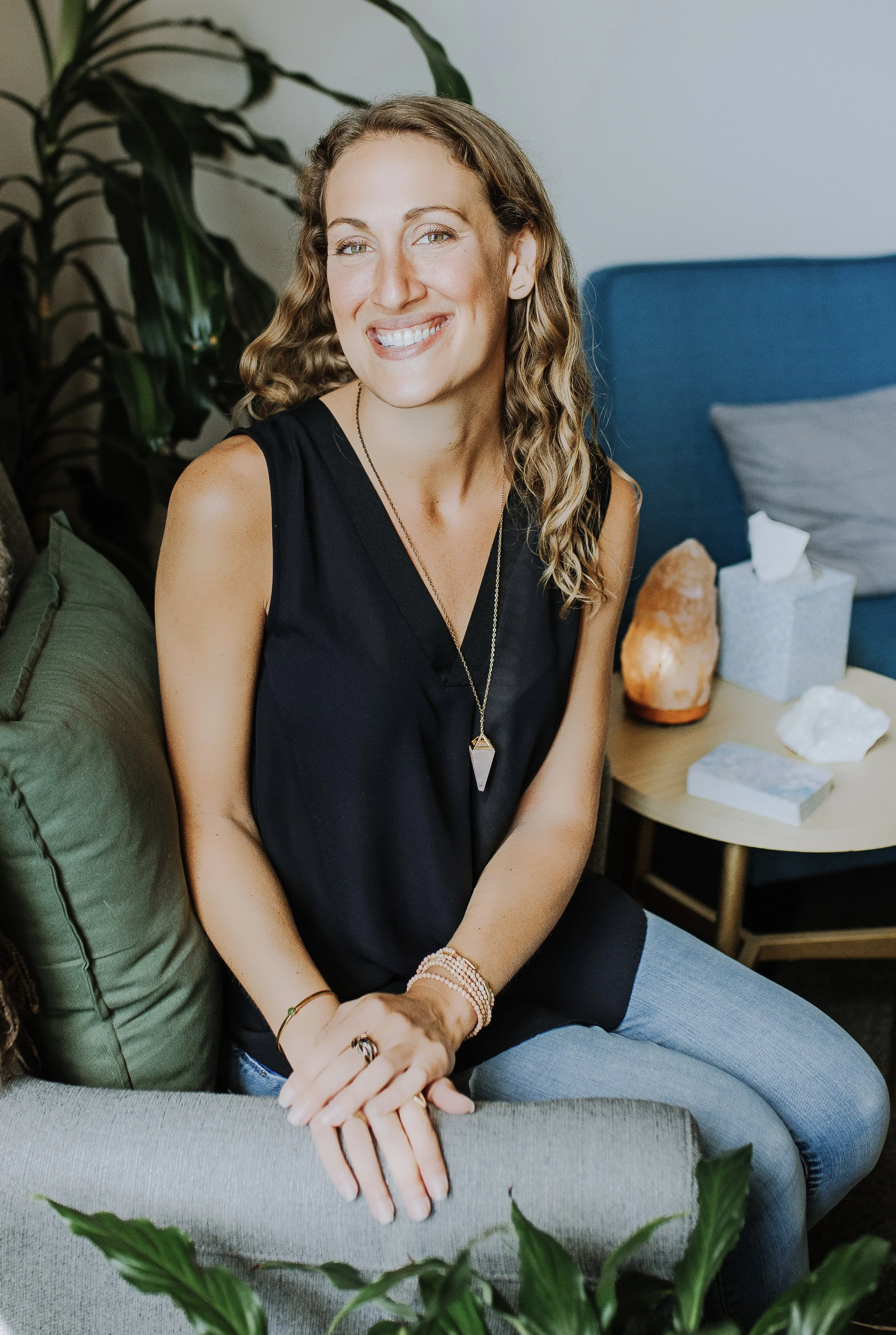 jenn sitting in office, guiding clients through therapeutic human design