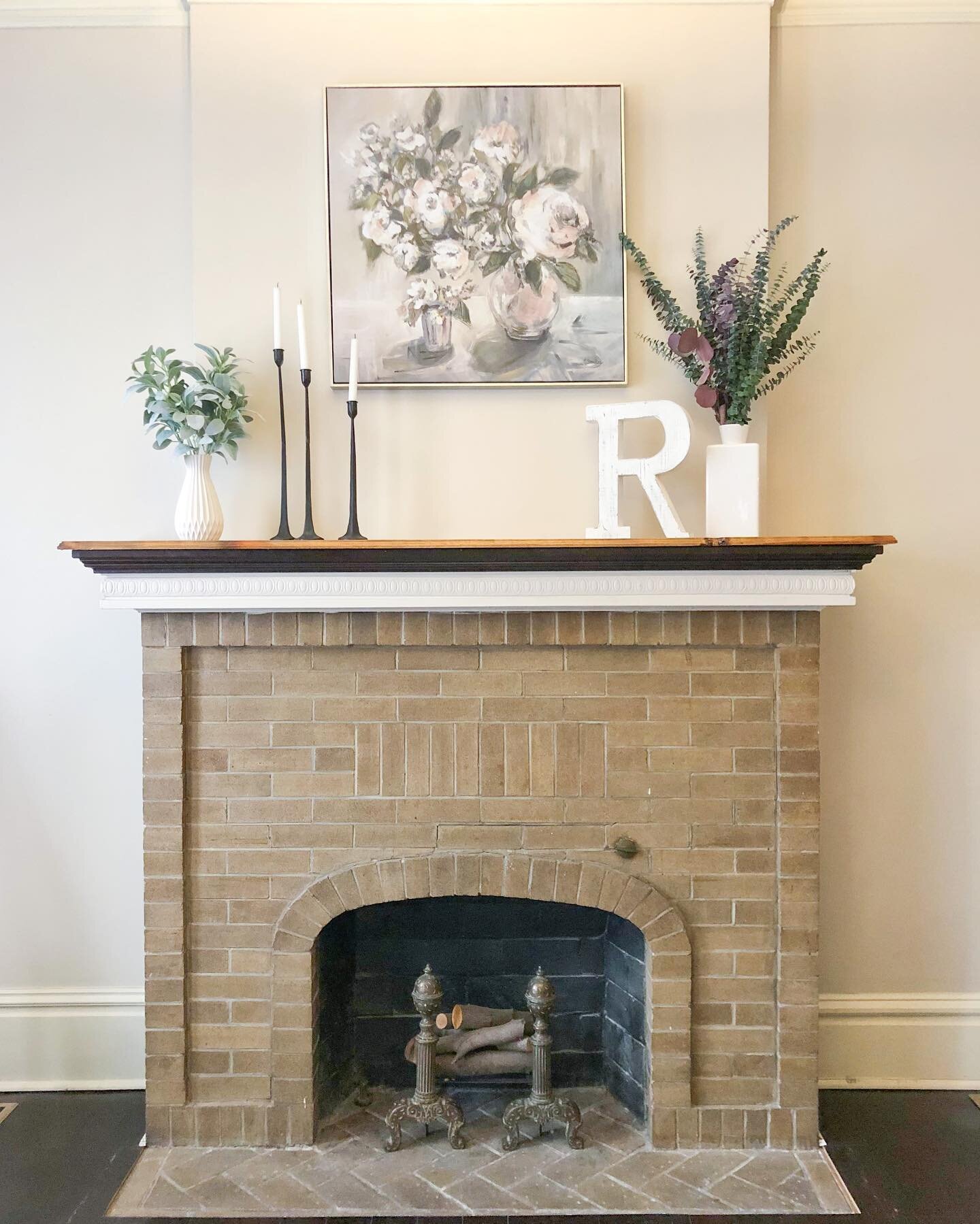 before &amp; after: fireplace edition

this fireplace was underutilized and underwhelming. the additional weird tile hearth distracted from the gorgeous brick. we removed that eyesore, gave the room a fresh coat of paint, and added minimal decor to t