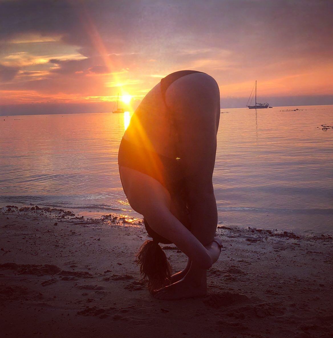 Uttanasana : Standing forward fold. 
Draping the body over the legs into an inversion is a calming pose as the mind draws inward allowing us to tune out the noise of the world. 

Wishing I was back on this beach in Thailand, pulling some shapes, and 