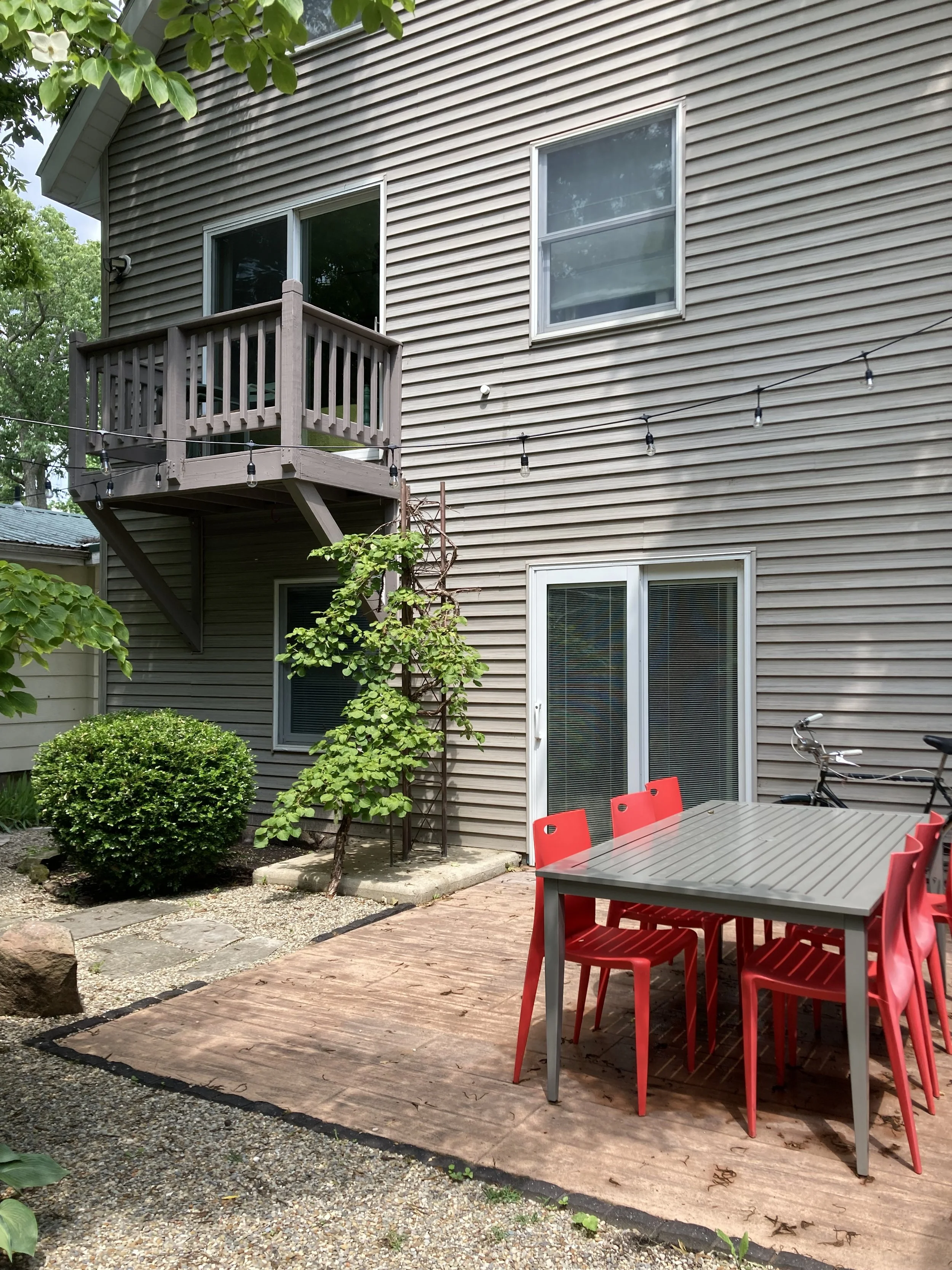 Backyard Patio with Dining Table and String Lights