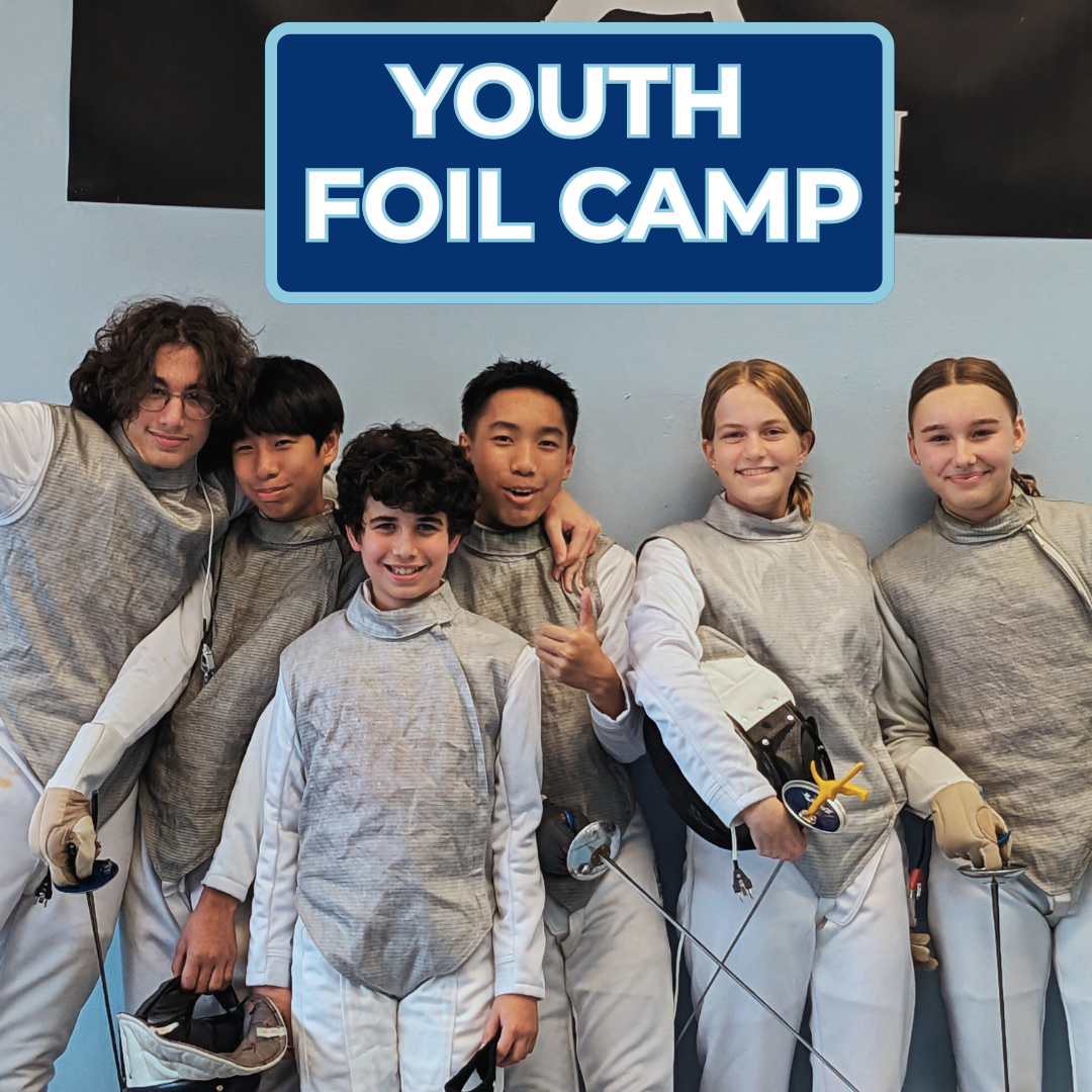 Group of six children in fencing gear at youth foil camp, smiling and posing for a photo.