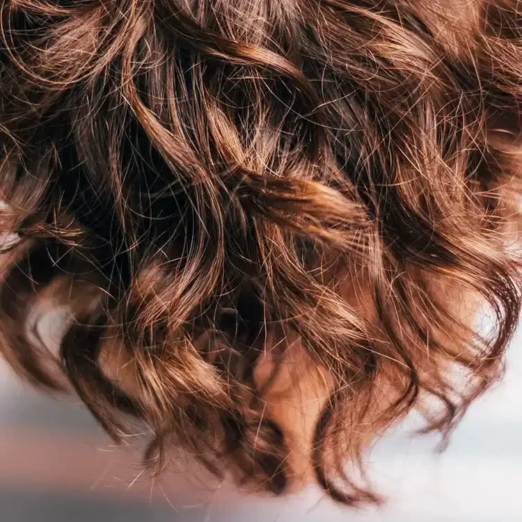 Luxury Portland Oregon hair extensions creating soft curls and natural volume