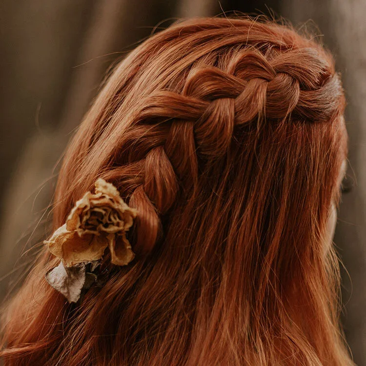 Portrait of a young woman with a plaited hairstyle