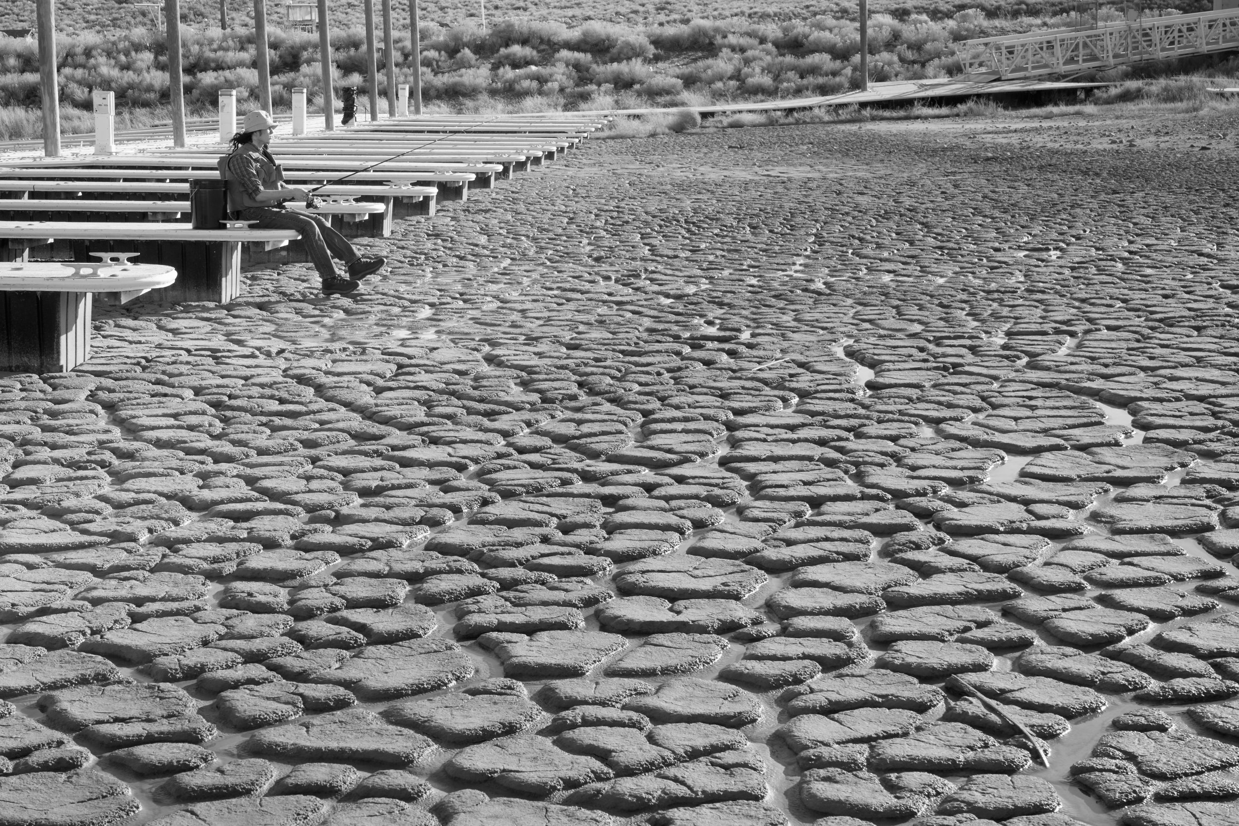 Mountain landscape with forested slopes and evening sunlight.