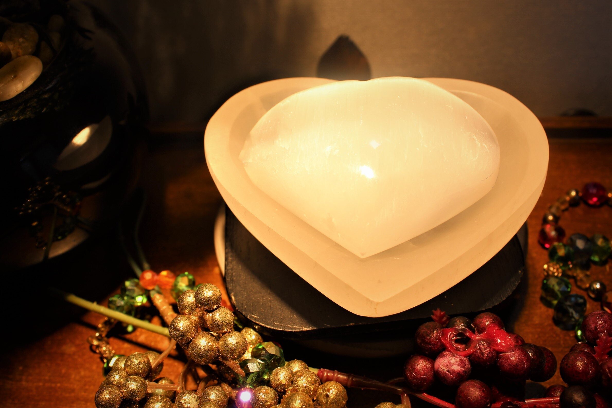 Exquisite Moroccan Selenite heart tray, enhanced with a Selenite Puffy Heart for an additional charge, offers a unique and spiritually energizing visual experience. Perfect for your sacred space.
