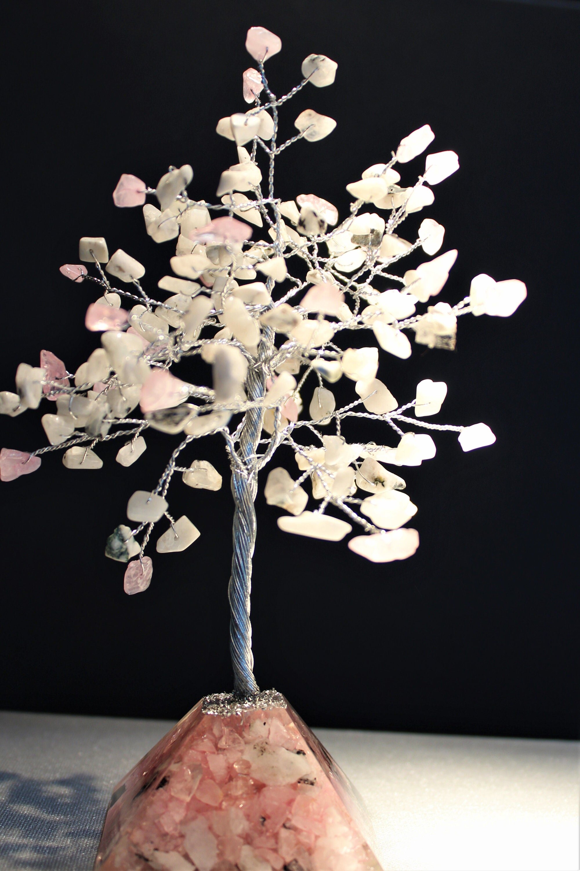 Embrace the spiritual power of moonstone and rose quartz with this stunning June birthstone tree. Its orgonite base amplifies energy, fostering love, healing, and balance