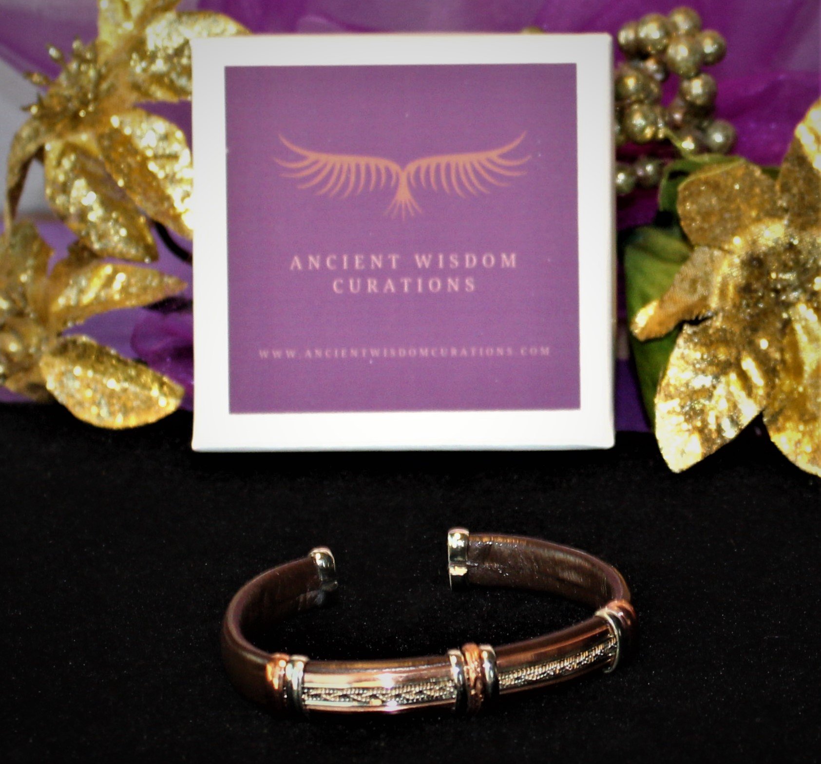 Artisan-made brown leather cuff bracelet featuring a sleek, textured bar design with varied colored coppers—elegant and durable, perfect for any occasion.