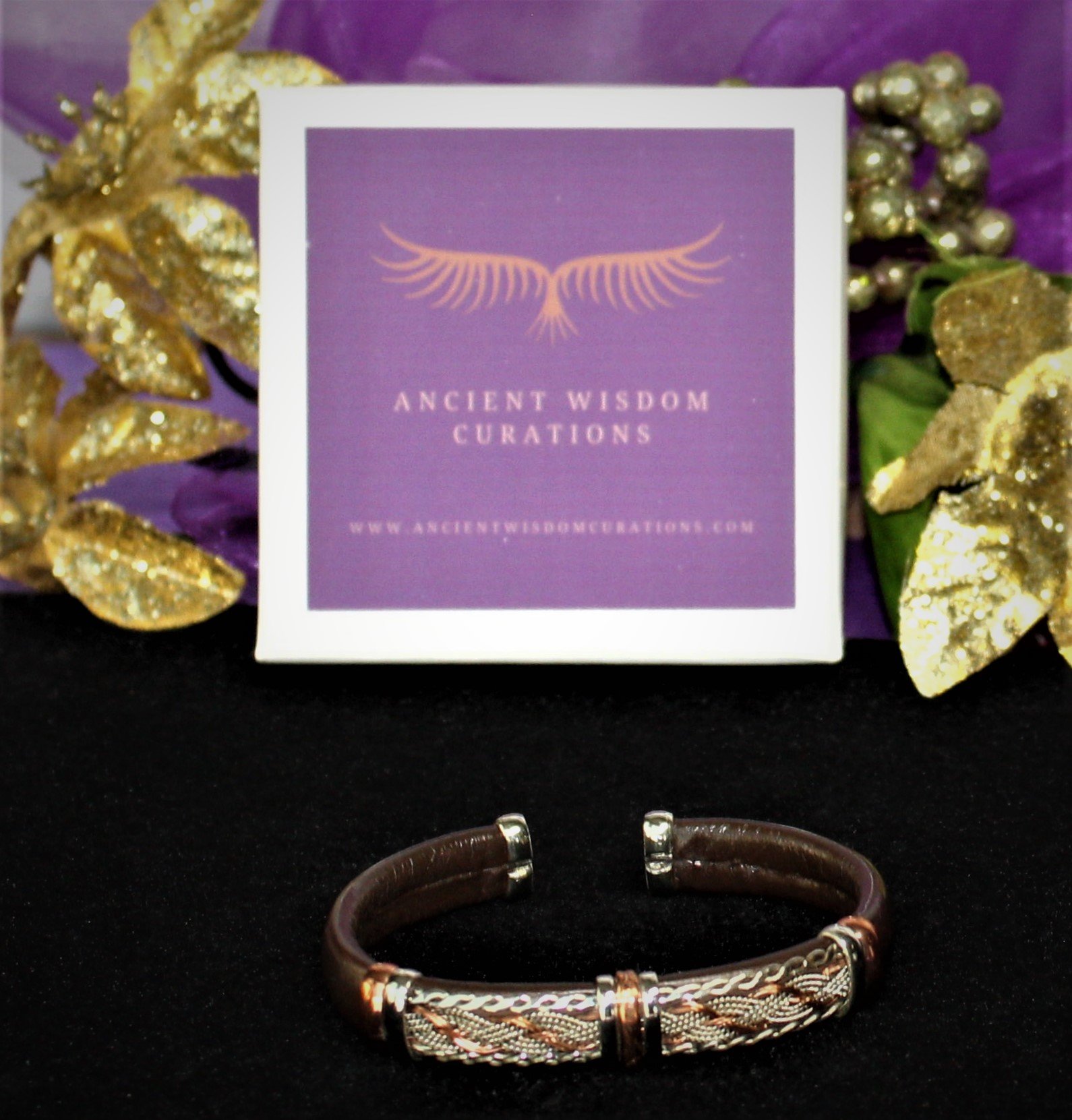 Artisan-made brown leather cuff bracelet featuring a woven and scalloped design with varied colored coppers—elegant and durable, perfect for any occasion.