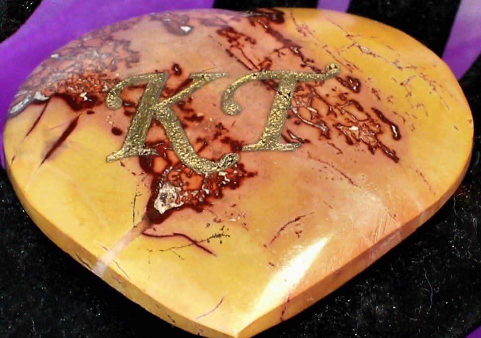 Custom engraved Mookaite heart stone with natural marbling, blending ancient wisdom with personalized elegance—ideal for gifts or spiritual decor.