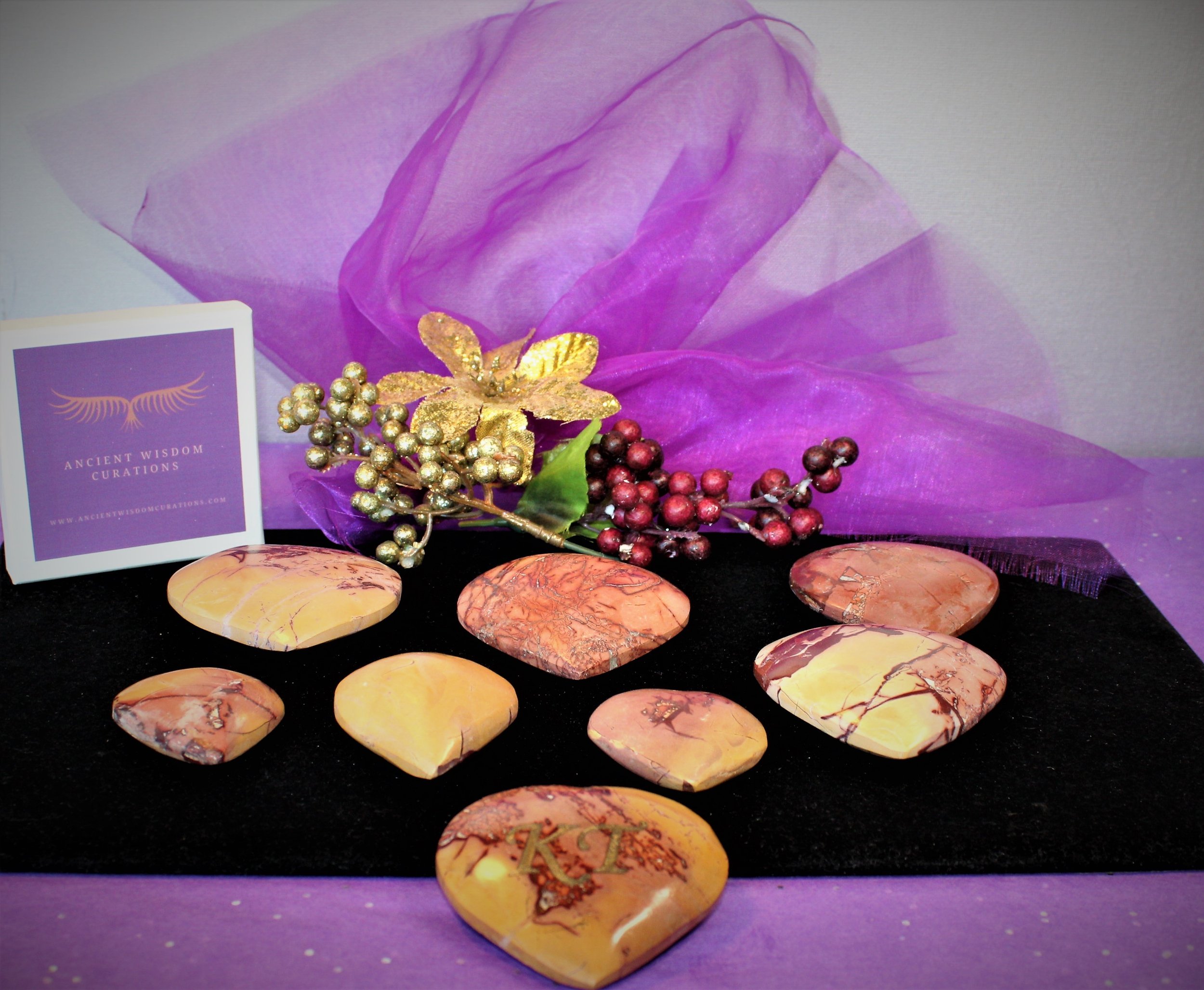 Collection of Mookaite stones with natural patterns, elegantly displayed by Ancient Wisdom Curations—perfect for decor, gifting, or spiritual practices.