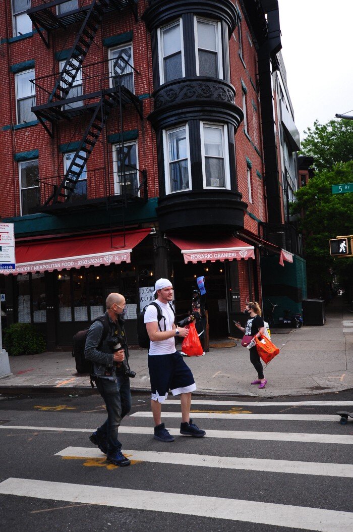  Two suspected white supremacists followed this protest in Brooklyn from Bay Ridge to Barclays Center, photographing individual faces and identifying features along the way. The one in the white hat offered these to the police at the end of the march