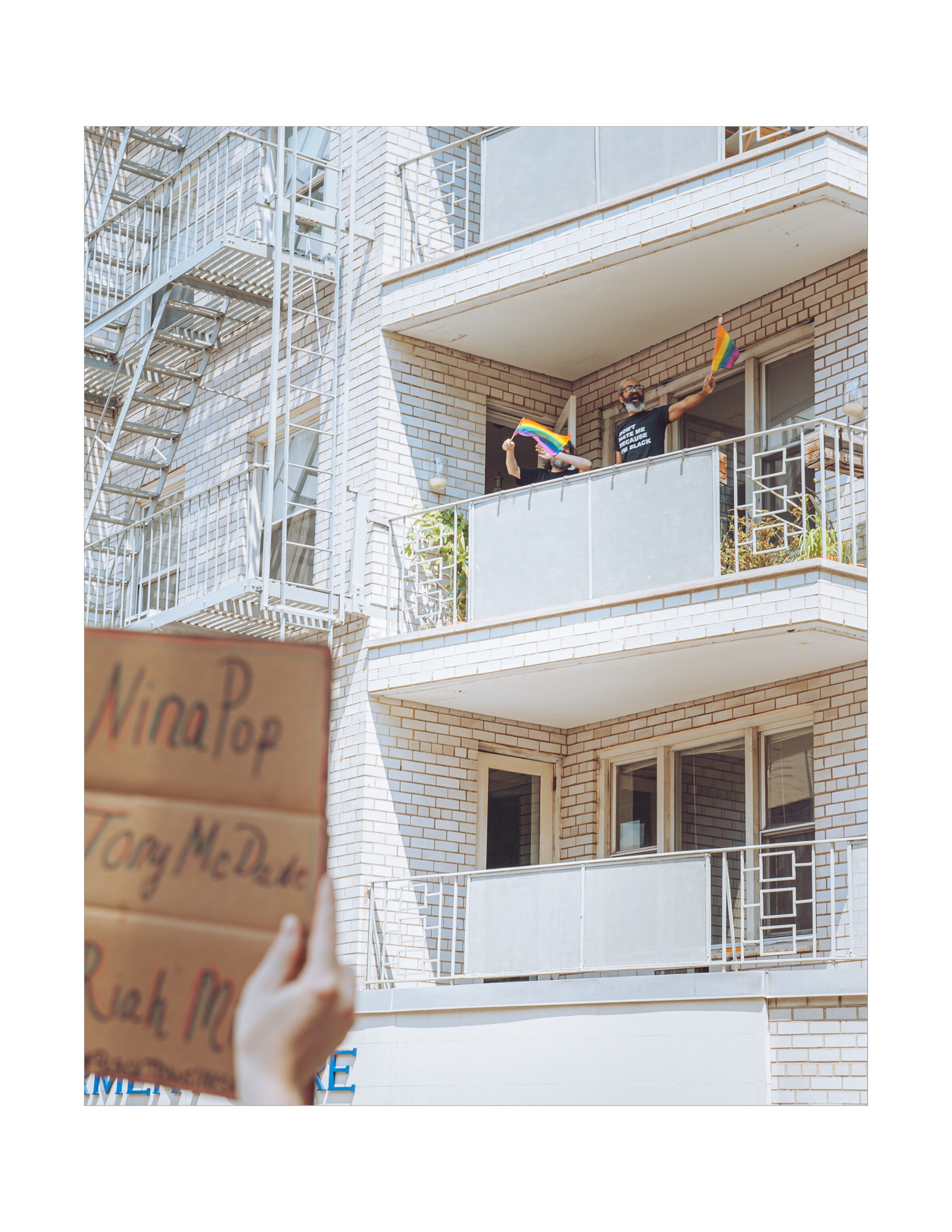  Onlookers wave flags in support of the Queer Liberation March for Black Lives Matter. 