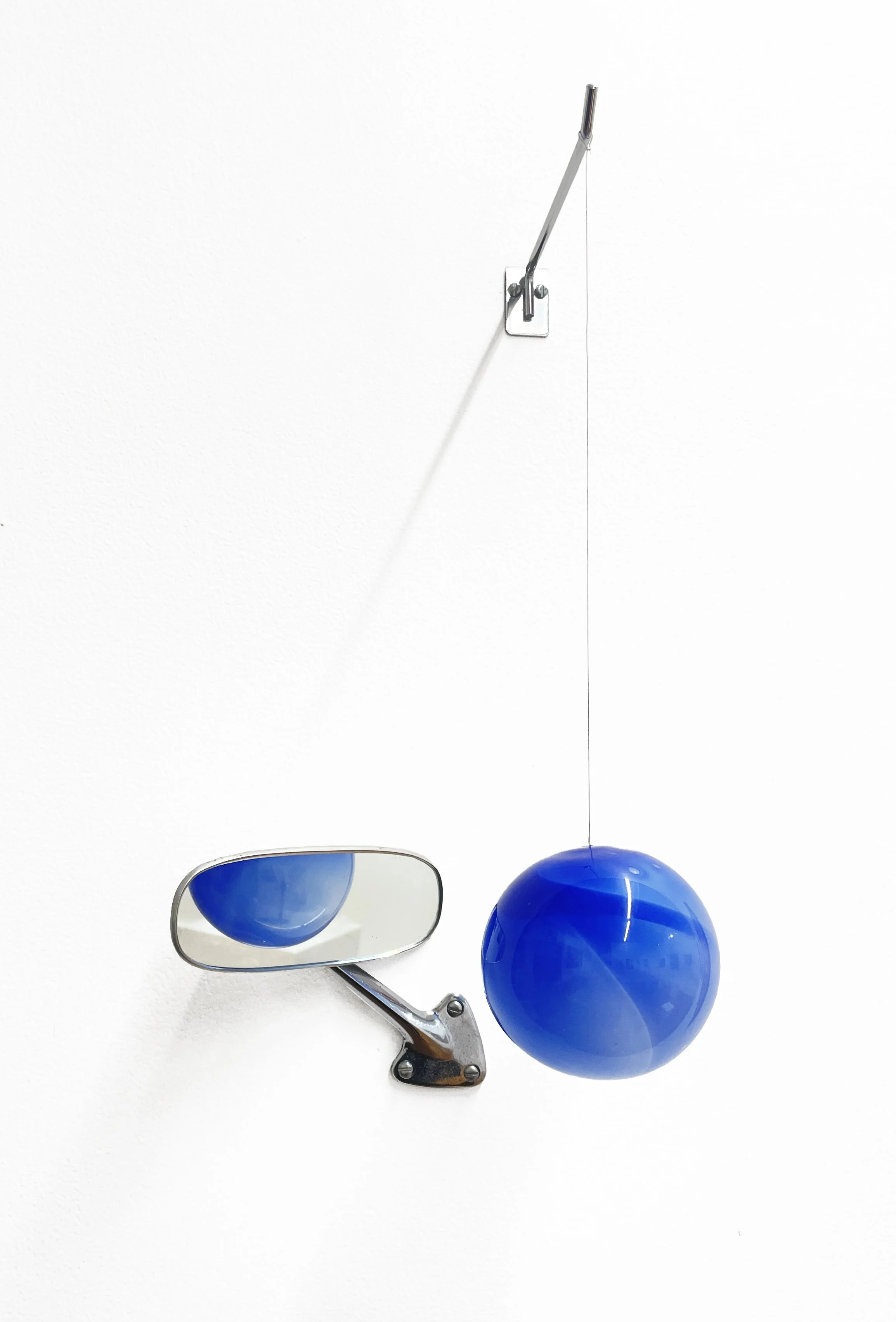 Inna Babaeva, Don’t Get Me Wrong, 2026, Hand blown glass, vintage car side view mirror, metal hook, 20 × 14 × 6 in.jpeg