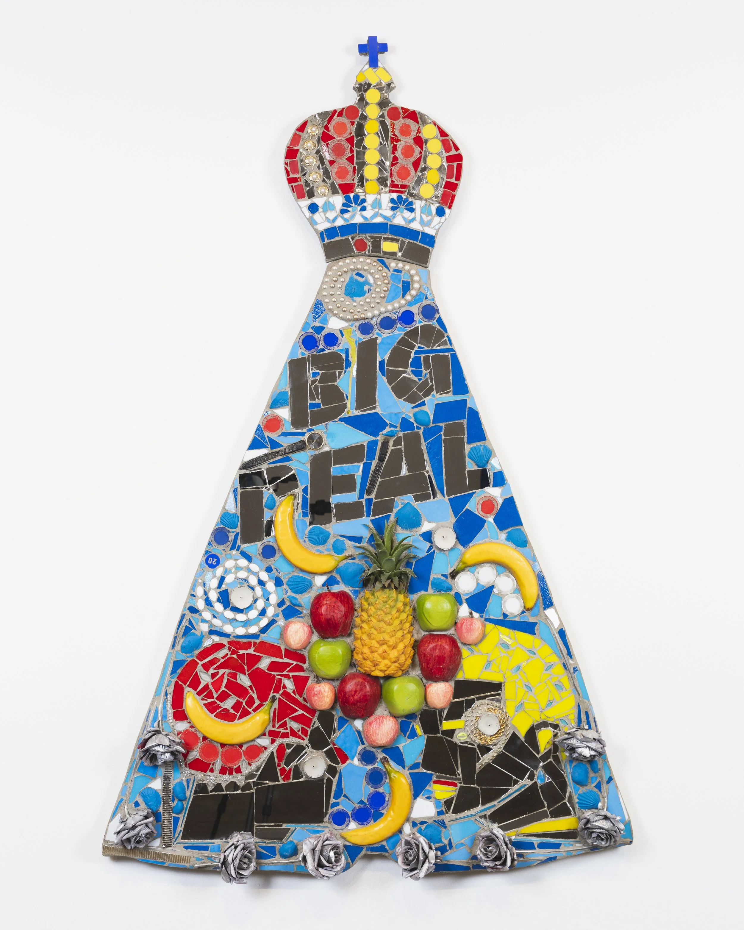 Marco DaSilva, "BIG DEAL, 2025," Foam fruit, plastic pineapple, candles, poker chips, necklaces, watch, bingo chip, plastic flowers, spray paint, plastic cowry shell, plastic fish, shells, house paint, mirror and mortar on compressed foam board, 36 ×