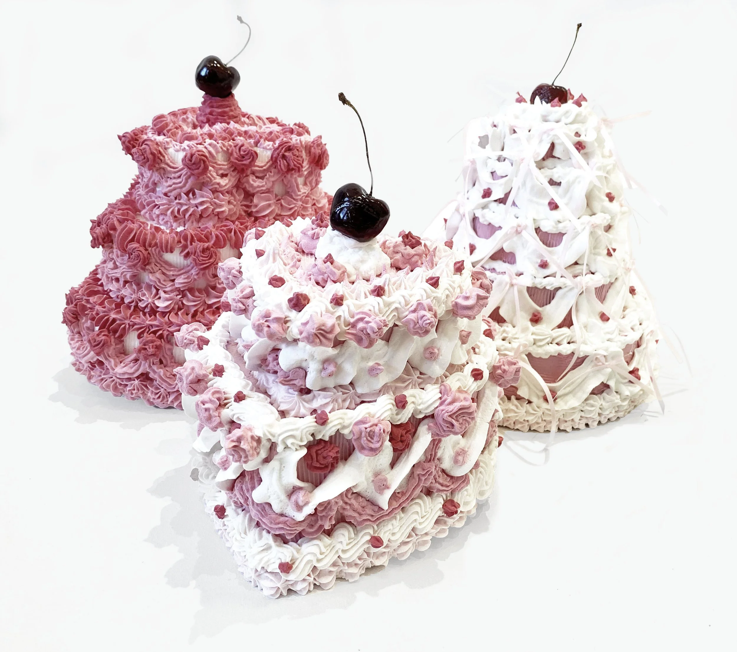 Kate Bancroft
The Three Graces, 2026
Spackle, acrylic, cardboard, polystyrene, glazed ceramic, ribbon, varnished cherry stems
Variable Dimentions