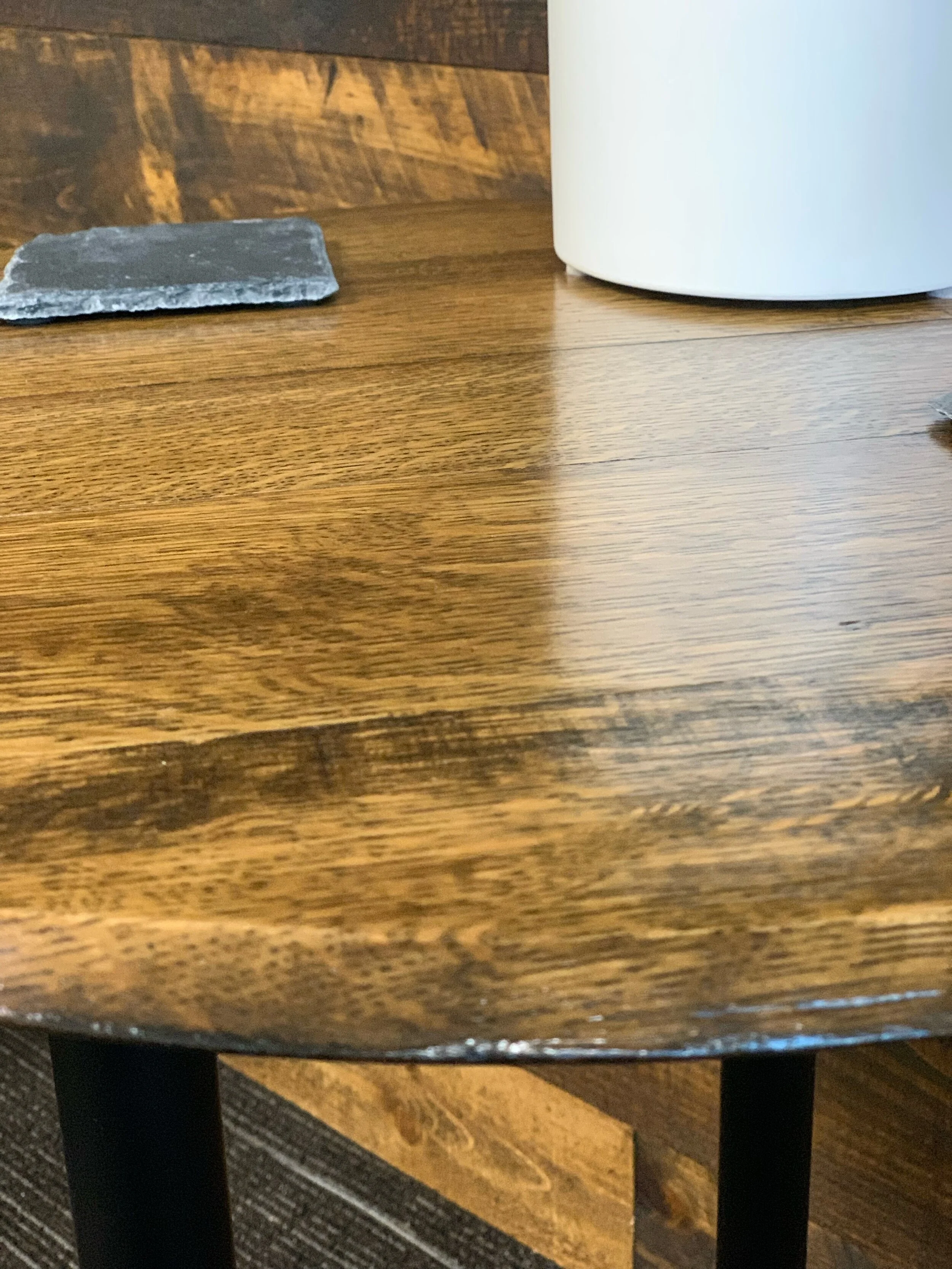 Old World Company - Bourbon whiskey barrel head end table with black gas pipe legs. 