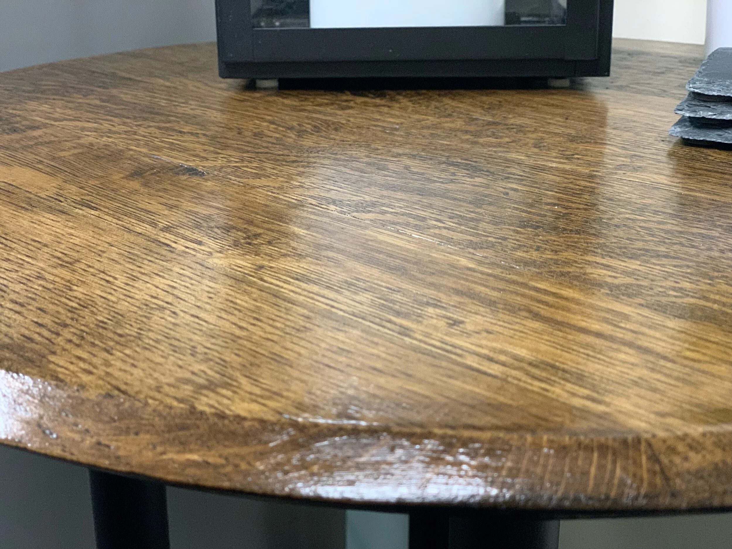 Old World Company - Bourbon whiskey barrel head end table with black gas pipe legs. 