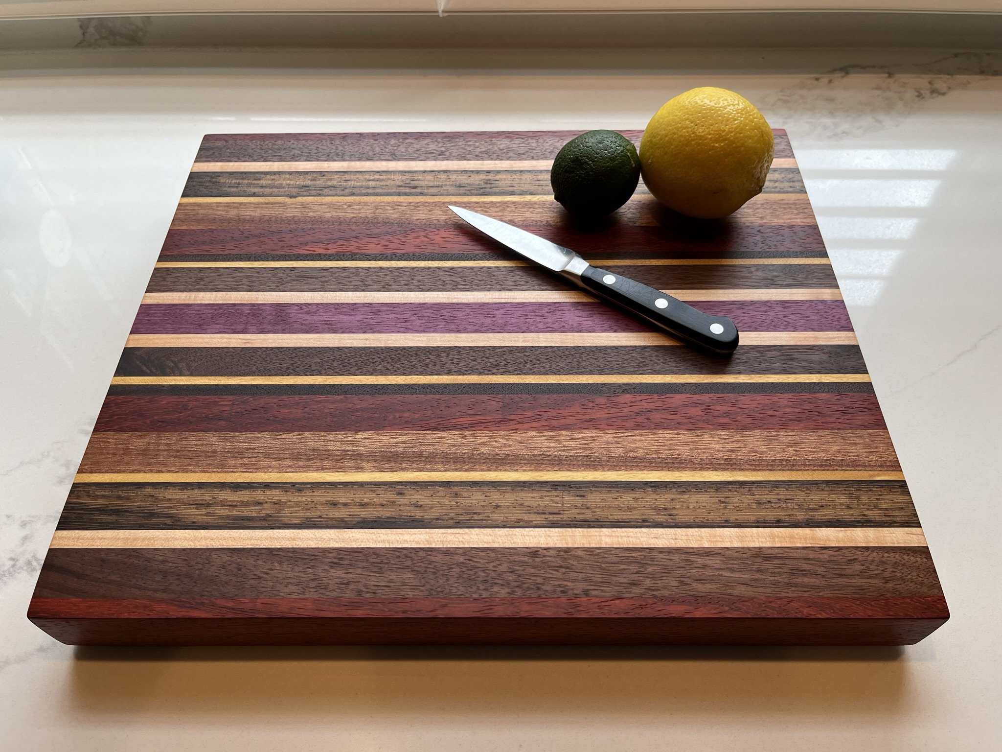 Old World Company: The Vegas - A colorful blend of walnut, wenge, padouk, maple, yellow heart, purple heart, and beech. 