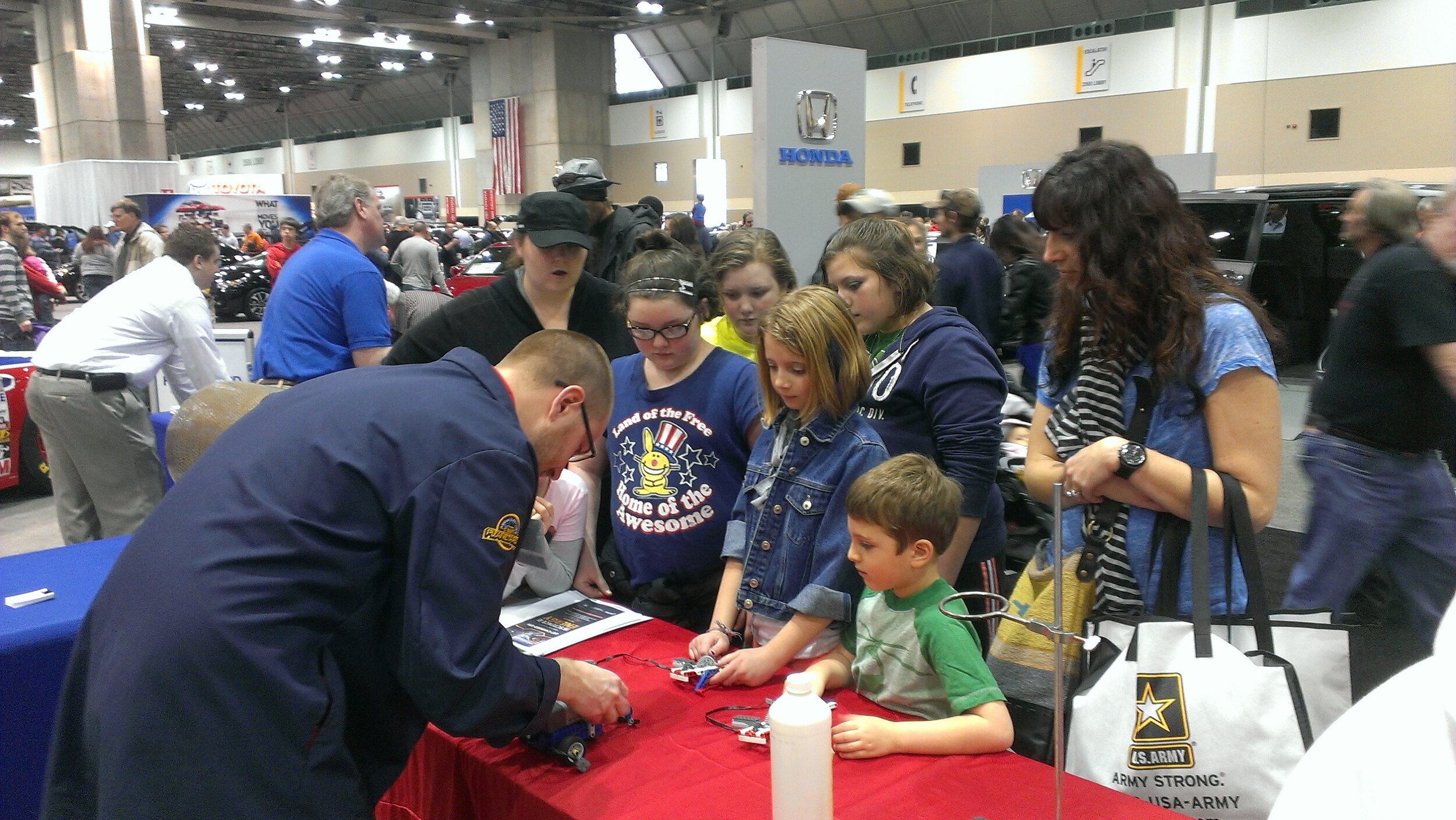 Robotics education outreach at a local auto convention.