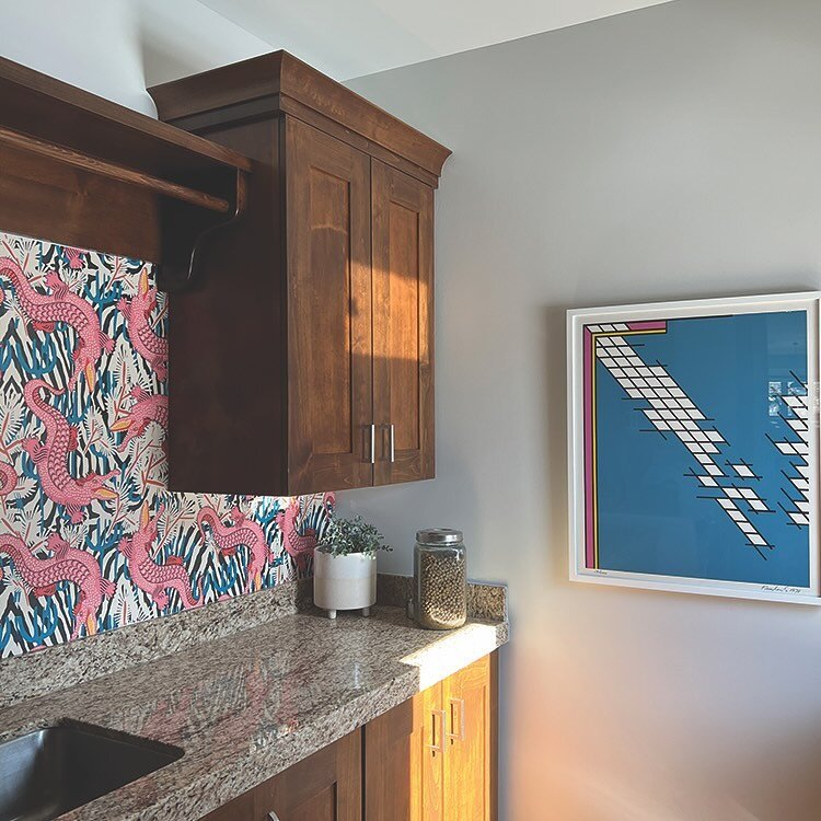 Here is a before and after. When your funds and budget are low, there are always economical ways to change things up. Here we added a funky wallpaper for about $300, switched out the cabinet pulls for about $40, and added a colorful piece of art. The