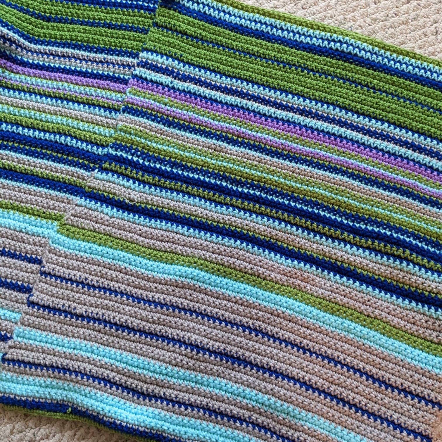 Crochet Weather Blanket. Each row represents the highest temperature of the day.