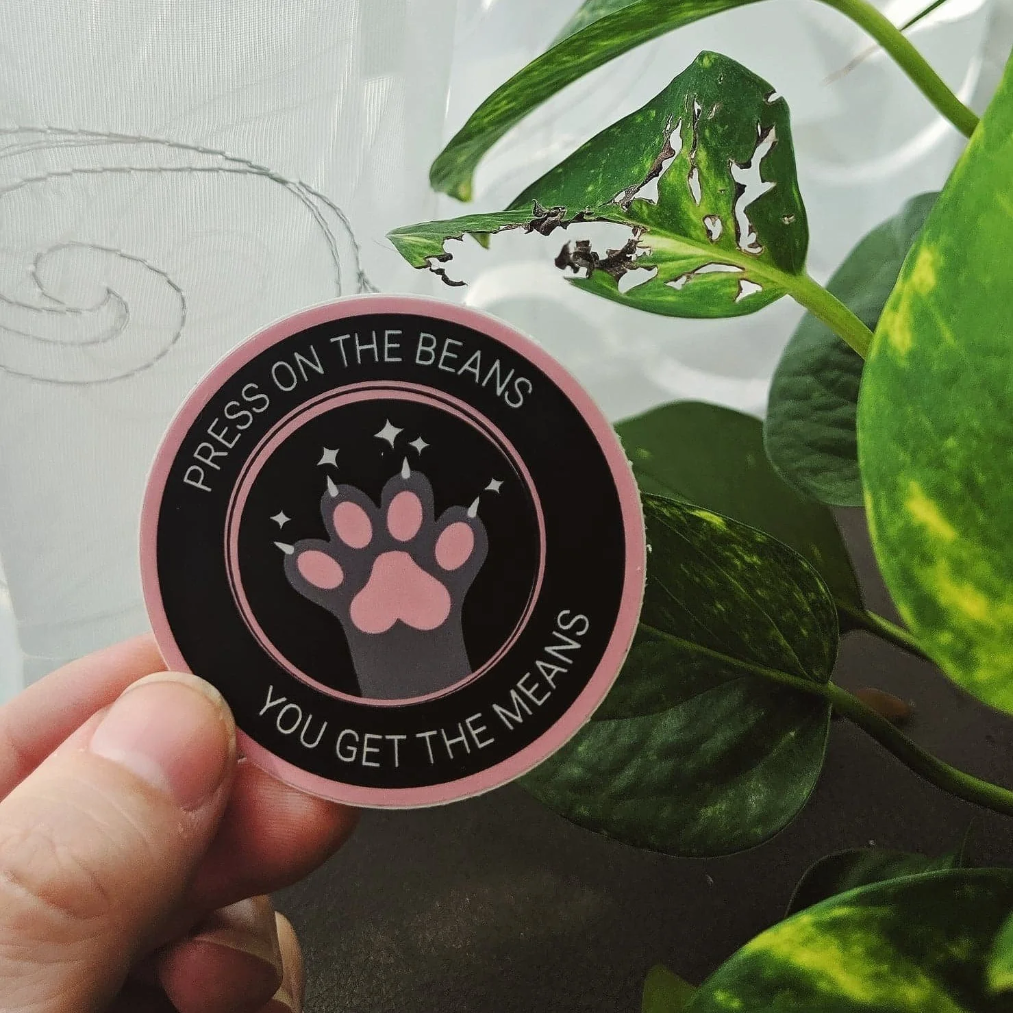 Press on the beans, you get the means sticker