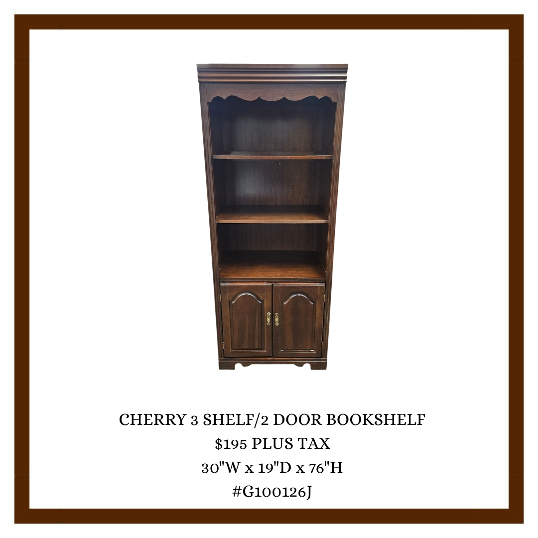 A wooden cherry-colored bookshelf with three open shelves and two closed doors at the bottom.