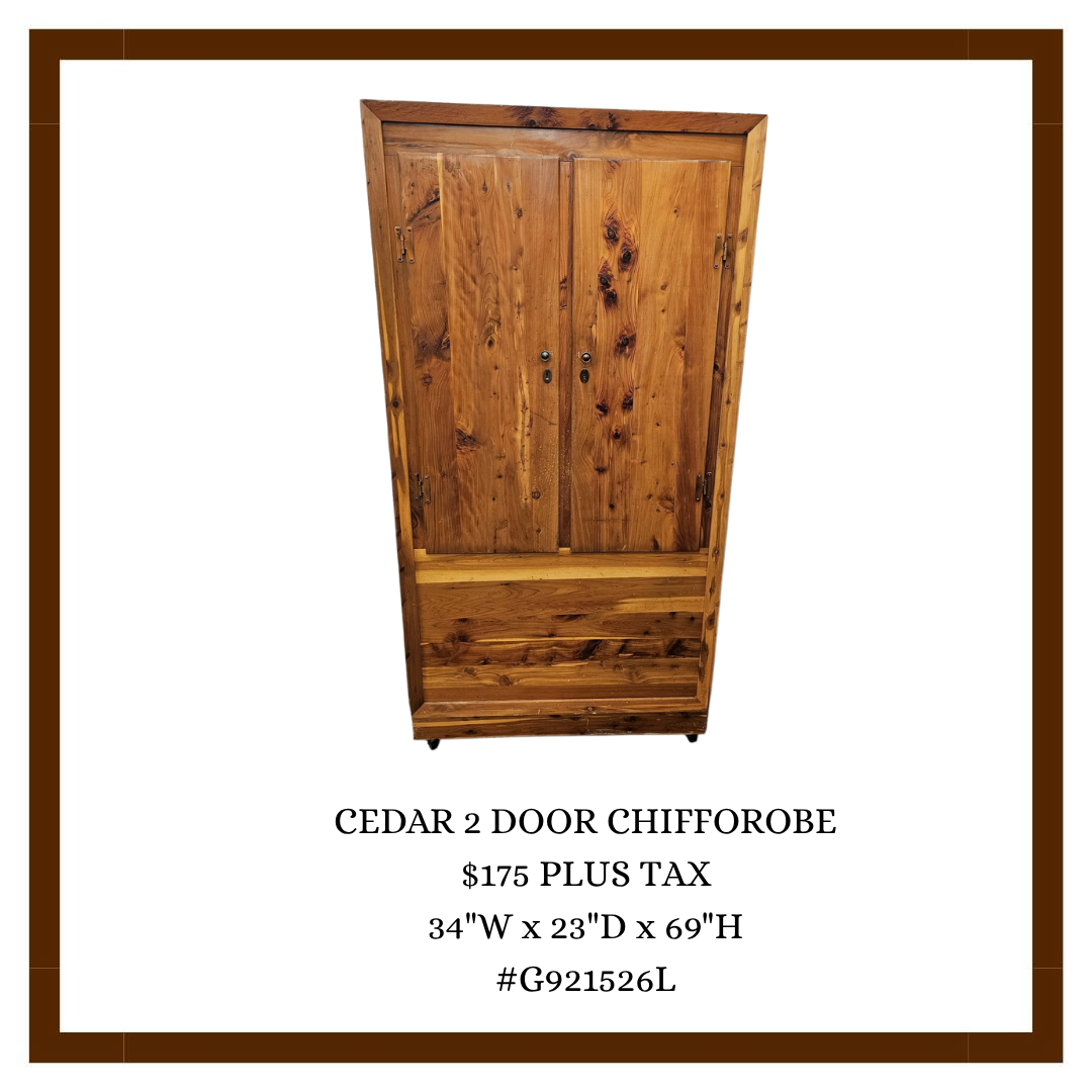 A wooden cedar 2-door chiffrobe with dimensions 34 inches wide, 23 inches deep, and 69 inches high for sale at $175 plus tax.