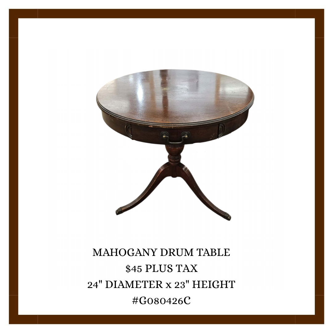 A round mahogany drum table with a dark finish on a white background, decorated with a brown border, and featuring a description with price, dimensions, and item code.